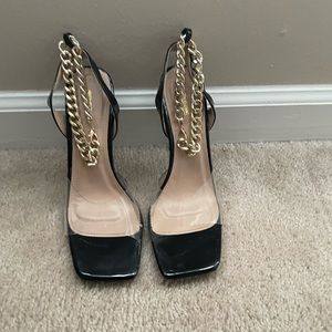 Black and Gold one strap heel